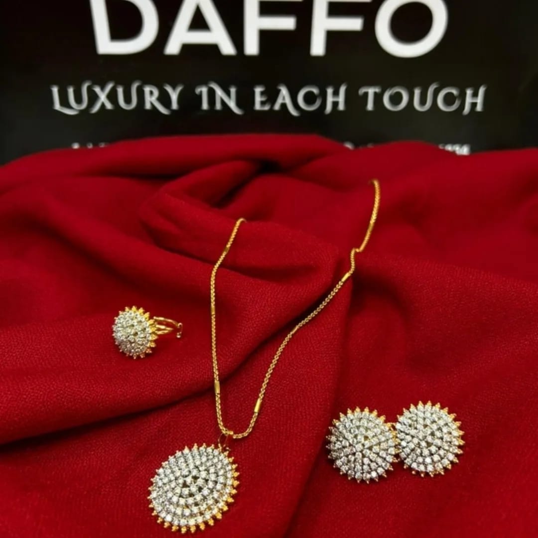 Jewelry set with brooches and necklace on a red fabric background with 'DAFFO' branding.