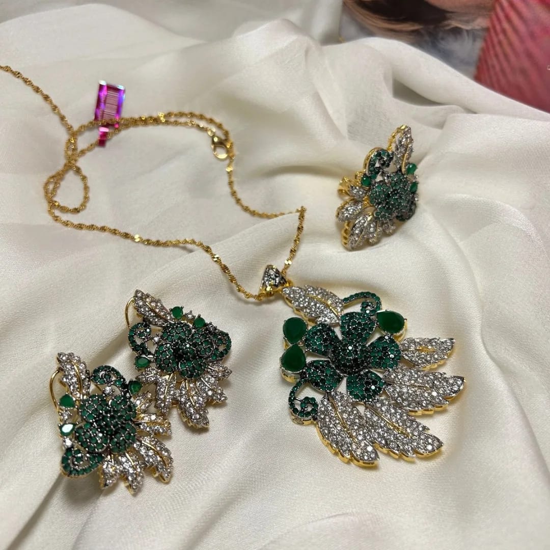 Jewelry set with necklace and earrings on a white fabric background